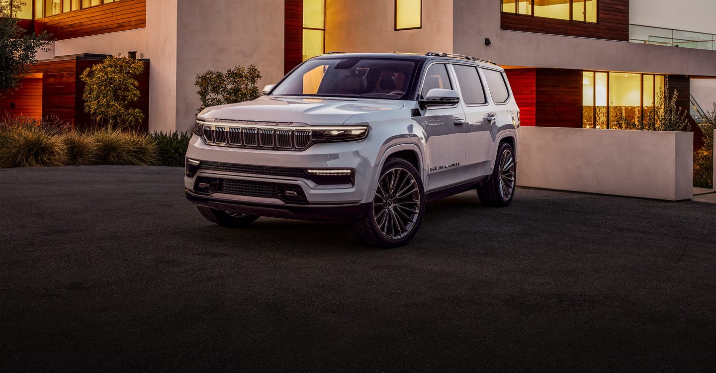 The Grand Wagoneer concept, parked outside a contemporary home.